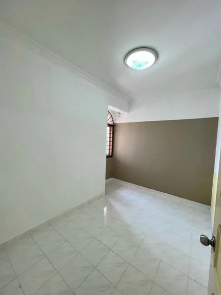 Room features: white painted walls, brown accent wall, marble tile flooring, ceiling light fixture, window with grille, no visible furniture.