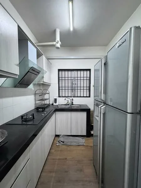 Kitchen features: black countertop, white cabinetry, stainless-steel fridge, built-in gas hob, stainless-steel range hood, single-bowl stainless-steel sink, chrome pull-down faucet, tile backsplash, wood-look laminate flooring, window with black grille, kitchen towel on floor; style: modern.