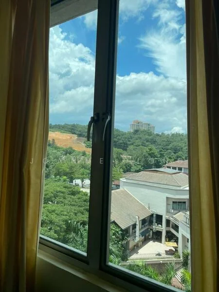 Room features: large window, curtains in yellow, view of greenery, view of buildings in distance, blue sky with clouds; view: garden.
