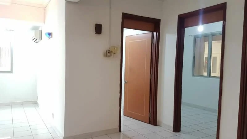Room features: white painted walls, tile flooring, 1 wall-mounted split AC, door with wooden frame, door with orange finish, window with glass panes, light fixture on ceiling, neutral color scheme.