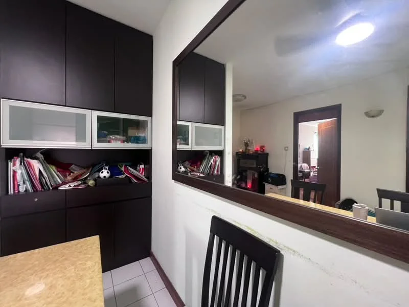 Room features: dark wood cabinetry, mirror on wall, light-colored countertop, white tiled flooring, stacked papers and items on countertop, doorway leading to another room, overhead ceiling light; style: modern.