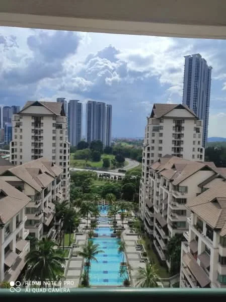 Exterior type: high-rise condominium; features: swimming pool with landscaped gardens, palm trees lining the pool area, surrounding high-rise buildings, walkway leading through the garden, water features in the pool area, balconies on the condominium buildings, cloudy sky, urban landscape in the background; style: modern.