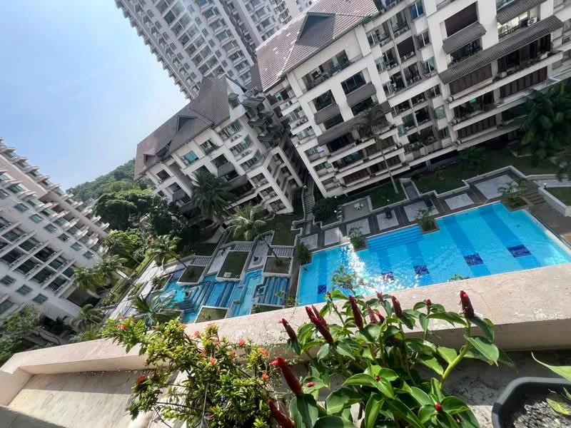 Exterior type: high-rise condominium; features: multiple swimming pools, landscaped gardens, palm trees, balconies on upper floors, modern architecture, pool deck with loungers, water features, surrounding greenery; style: modern.