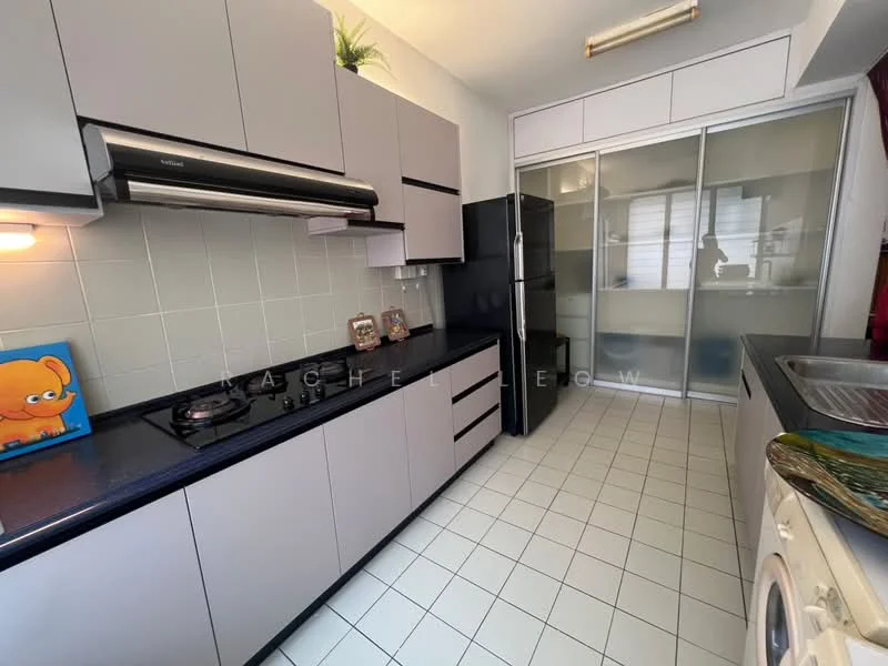 Kitchen features: grey cabinetry, black countertop, stainless-steel gas hob, stainless-steel range hood, built-in refrigerator, double-bowl stainless-steel sink, white tiled backsplash, white tiled flooring, washing machine, sliding glass door, open shelving, wall-mounted cabinet; style: modern.