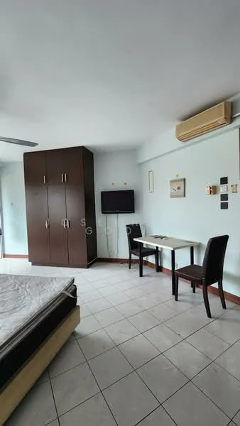 Room features: queen-size bed, wooden wardrobe with sliding doors, wall-mounted TV, study desk, two dining chairs, split air conditioning unit, tiled flooring, light blue painted walls, ceiling fan; style: modern.