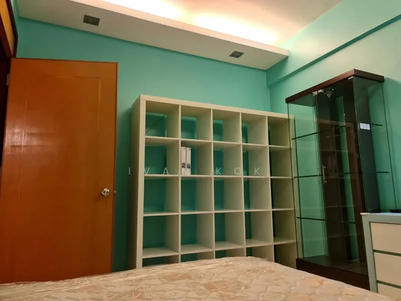 Bedroom features: turquoise painted walls, white shelving unit with cubbies, glass display cabinet, wooden door, recessed ceiling lights, bed with patterned bedding, laminate flooring; style: modern.