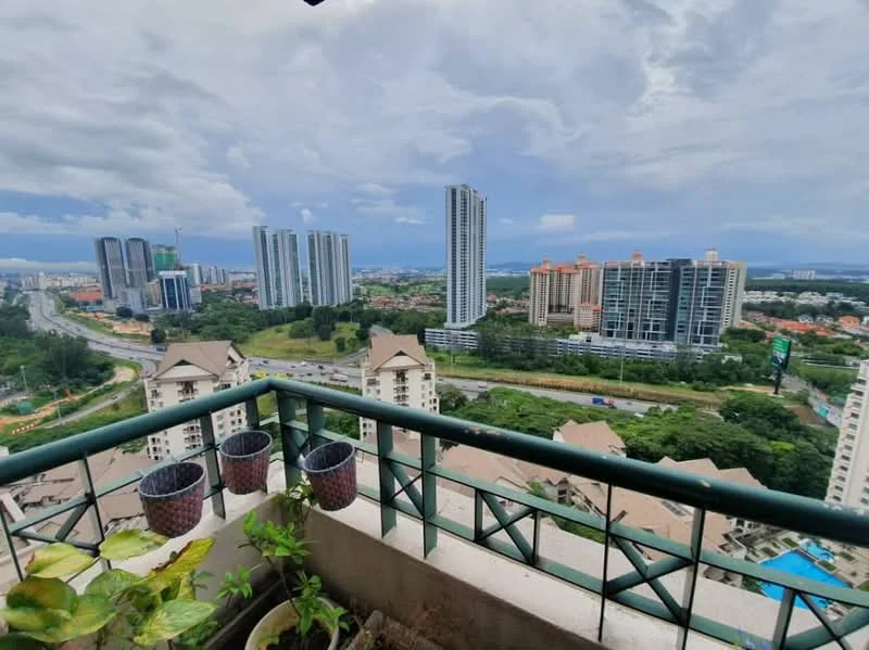 Room features: balcony with railing, potted plants, city skyline view, high-rise buildings in background, cloudy sky, urban landscape, road visible below; view: city.