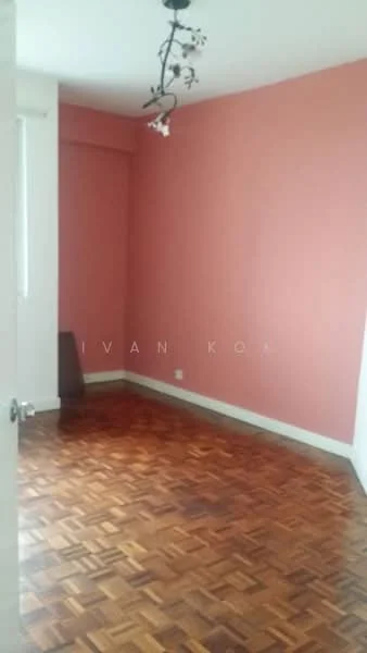 Room features: pink painted walls, parquet wood flooring, ceiling light fixture with floral design, window with natural light.