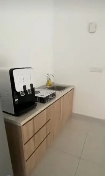 Kitchen features: single-bowl stainless-steel sink, chrome pull-down faucet, light wood cabinetry with drawers, grey countertop, white walls, tile flooring, water dispenser, built-in electrical outlet; style: modern.