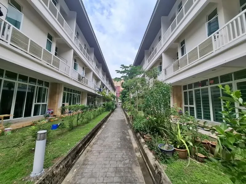 Exterior type: low-rise apartment block; features: two-storey building, balconies on upper level, landscaped garden, pathway with paving stones, greenery with plants and shrubs, windows with glass panes, outdoor lighting, fenced area, surrounding trees; style: modern.