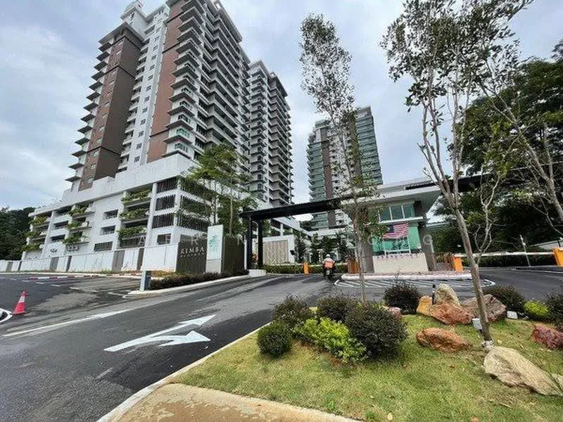 Exterior type: high-rise condominium; features: modern facade with glass and concrete, multiple storeys, landscaped entrance, manicured lawn, trees lining the entrance, paved driveway, security gate, visible parking area; style: modern.