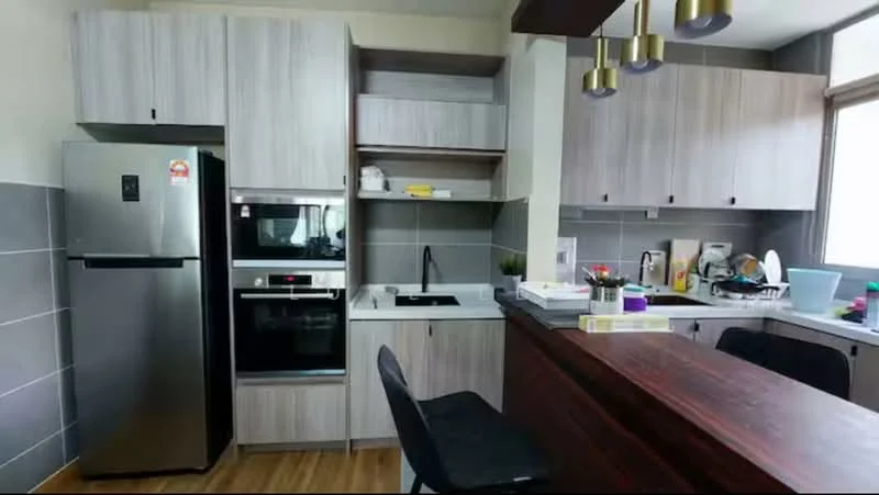 Kitchen features: stainless-steel fridge, built-in oven, freestanding range oven, single-bowl stainless-steel sink, chrome pull-down faucet, laminate countertop, grey cabinetry, open shelving, wooden bar counter, black bar stools, tile backsplash, wooden flooring, window with natural light; style: modern.