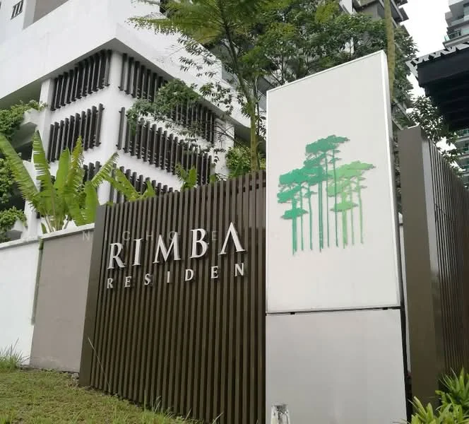 Exterior features: modern facade, signage with 'RIMBA RESIDEN', green landscaping, decorative wall with vertical slats, surrounding greenery, concrete structure, entrance gate, paved pathway; style: modern.