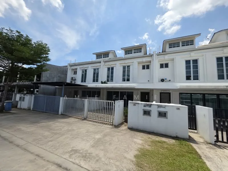 Exterior type: linked terrace house; features: white painted facade, flat roof, 3-storey building, front yard with grass, metal gate, fenced perimeter, multiple windows, parking space in front, mature trees nearby; style: modern.