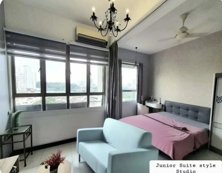 Bedroom features: king-size bed with grey upholstered headboard, light pink bedspread, 2 large windows with city view, grey curtains, white walls, ceiling with chandelier, wall-mounted air conditioning unit, light grey sofa, tile flooring, decorative plant in ceramic pot, study desk, built-in wardrobe with sliding doors; style: modern; view: city.