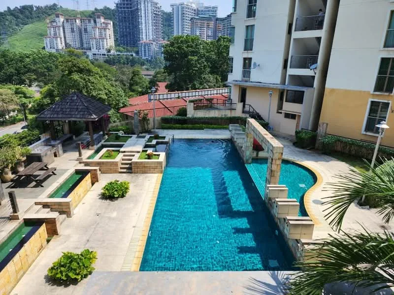 Exterior type: swimming pool deck; features: infinity pool, pool deck with loungers, landscaped garden with plants, paved walkway, gazebo, surrounding greenery, city skyline in background; style: modern.