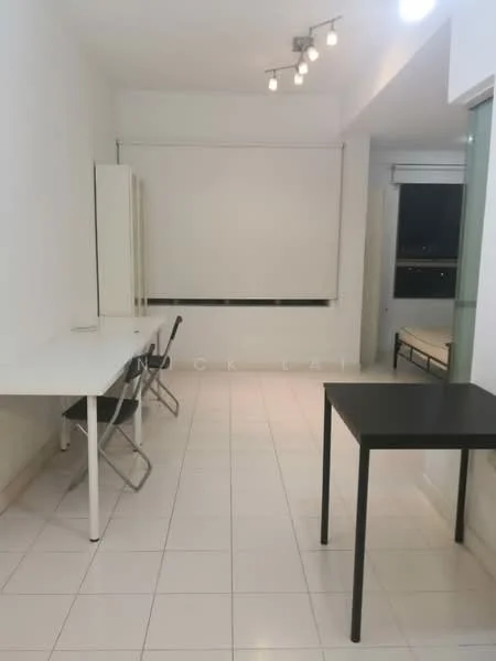 Room features: white painted walls, white tiled flooring, track lighting, large window with roller blinds, two white tables, black table, two folding chairs, minimalist decor; style: modern.