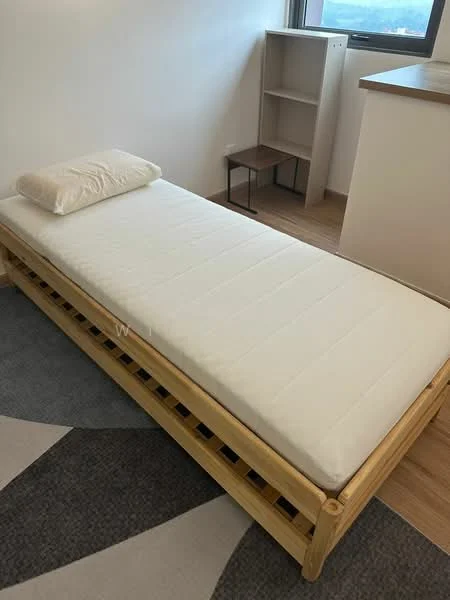 Bedroom features: single bed with wooden frame, mattress with white cover, pillow on bed, wooden bedside table, open shelving unit, light wood flooring, grey area rug with geometric pattern, window with city view; style: modern; view: city.