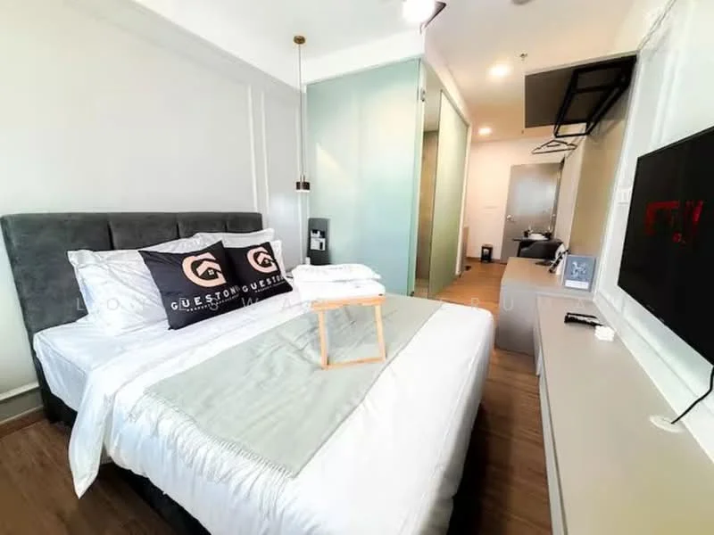 Bedroom features: queen-size bed with grey upholstered headboard, white bedding with decorative throw, nightstand with lamp, wall-mounted TV, built-in wardrobe with sliding doors, wooden flooring, large window with sheer curtains, decorative wall art, recessed lighting, air conditioning unit; style: modern.