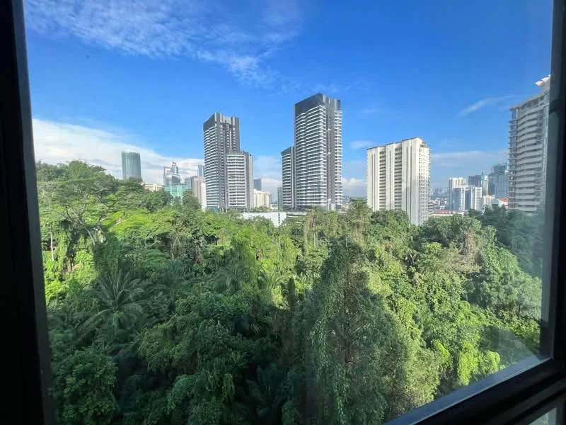 Exterior type: high-rise condominium; features: city skyline view, lush greenery in foreground, tall residential buildings, clear blue sky, urban landscape; style: modern.