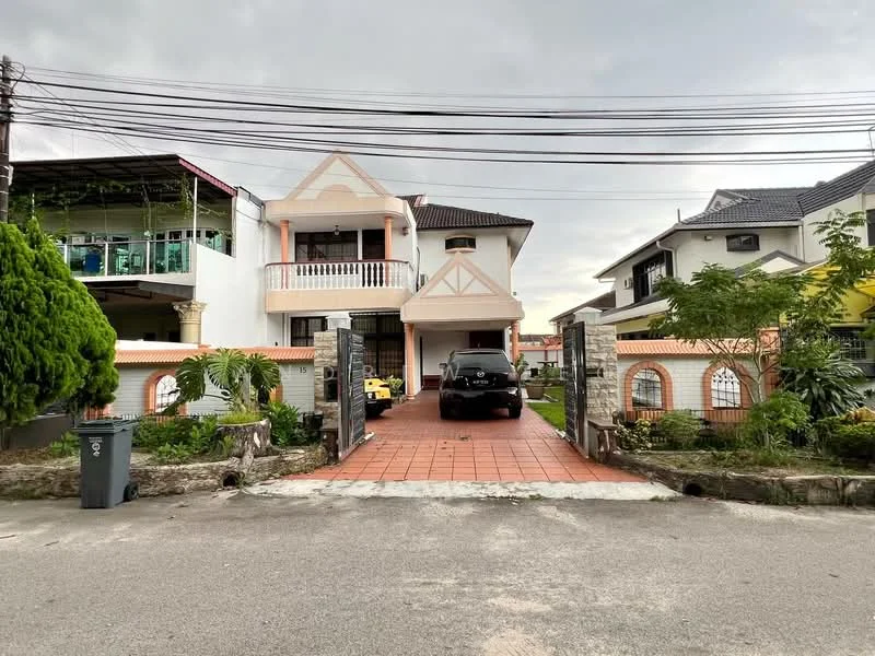 Exterior type: detached bungalow; features: two-storey building, paved driveway, manicured lawn, mature trees, front porch with railing, balcony on the upper floor, brick facade, decorative columns, surrounding greenery, visible car parked in driveway; style: traditional.