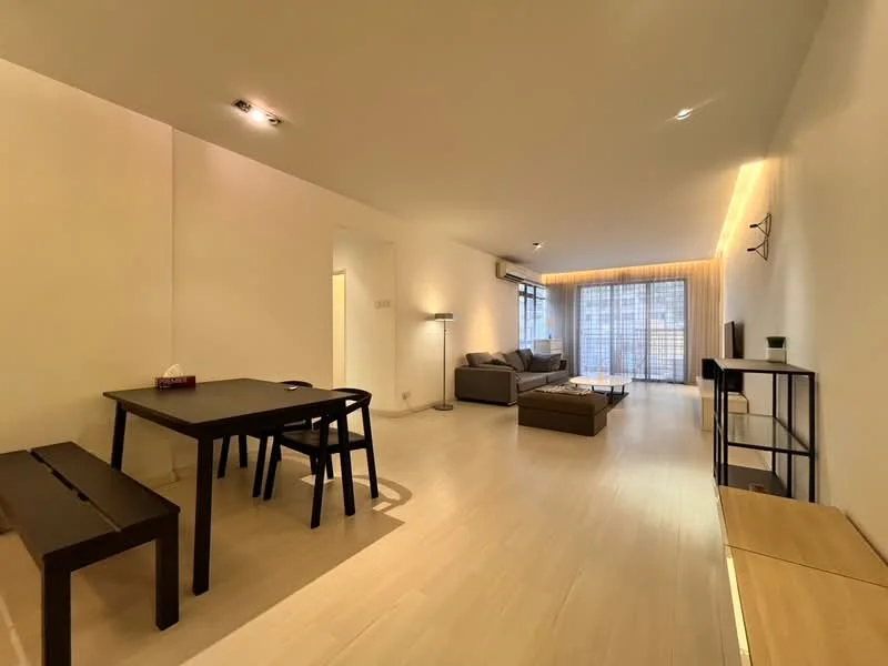 Living features: light wood flooring, white painted walls, recessed downlights, floor-to-ceiling windows, sheer curtains, sofa in grey fabric, coffee table, TV console, dining table with black finish, bench seating, decorative plant, wall-mounted TV; style: modern; view: city.