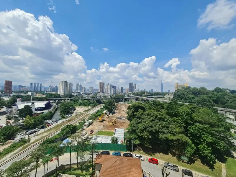 Exterior features: city skyline view, greenery in foreground, construction site visible, high-rise buildings in background, roadway infrastructure, cloudy blue sky; style: modern.