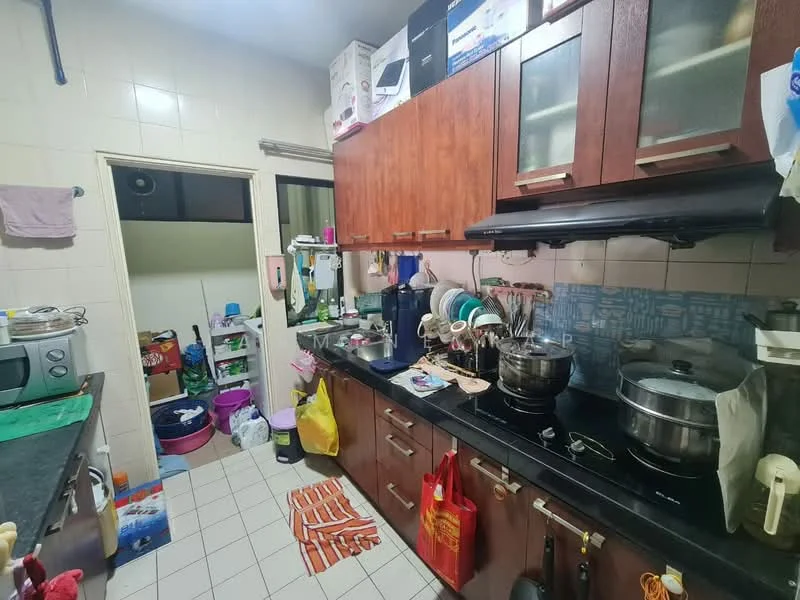 Kitchen features: wood cabinetry, black countertop, stainless-steel sink, chrome faucet, built-in stove, microwave, kitchen utensils, tile backsplash, white tiled walls, ceramic tile flooring, multiple storage containers, various kitchen appliances, hanging dish rack.