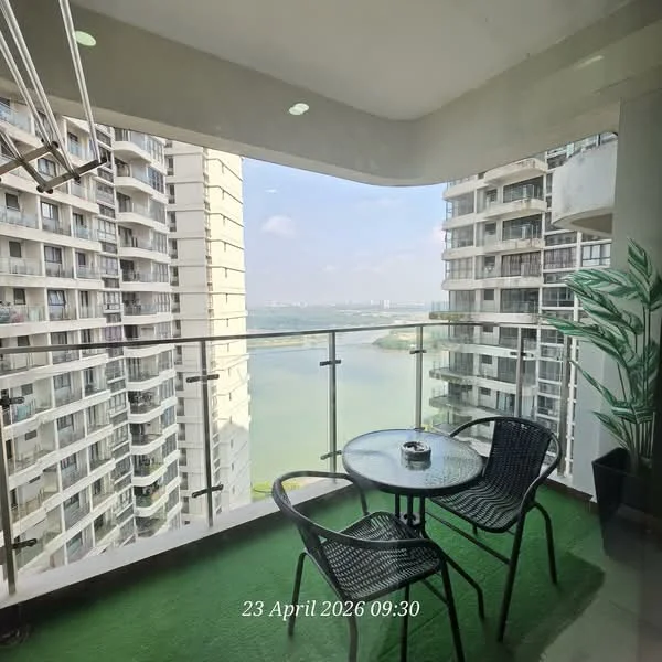 Balcony features: glass railing, artificial grass flooring, round glass table, two black metal chairs, potted plant, city view, water view; style: modern; view: city.