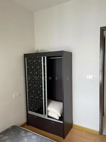 Room features: dark wood wardrobe with glass doors, two shelves inside wardrobe, two drawers at the bottom of wardrobe, light wood flooring, plain white walls, single bed with patterned bedding, neutral-colored wall, door frame visible; style: modern.