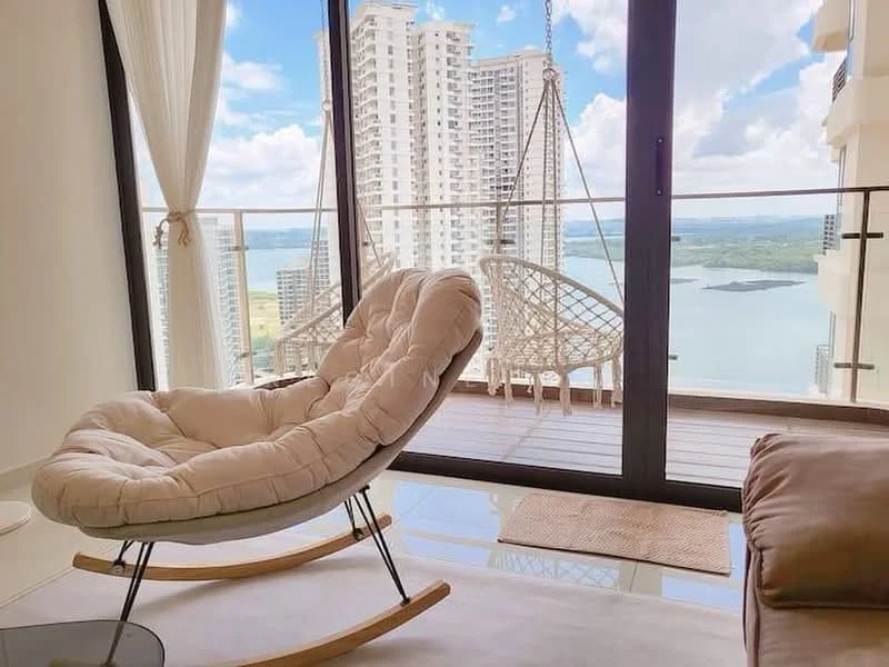 Living features: hanging rattan chair, rocking chair base, large floor-to-ceiling windows, white sheer curtains, wooden balcony flooring, beige area rug, view of city skyline, view of water, light-colored walls, modern decor; style: modern; view: city.