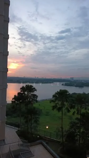Exterior features: waterfront view, sunset view, lush greenery, palm trees, manicured lawn, city skyline in background, outdoor lighting, balcony or terrace area; style: modern.