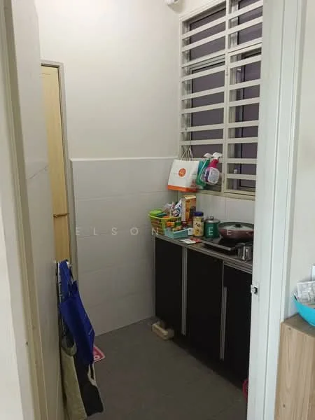 Kitchen features: black cabinetry, stainless-steel sink, single-bowl sink, countertop, wall-mounted shelves, tile backsplash, grey tile flooring, window with metal grilles, kitchen appliances, cleaning supplies on countertop.