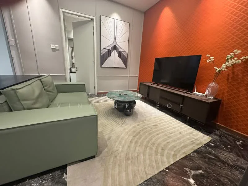 Living features: green fabric sofa, round coffee table with marble top, area rug with geometric pattern, wall-mounted TV, TV console in dark wood, orange accent wall with textured pattern, framed artwork on wall, recessed lighting, dark marble flooring; style: modern.