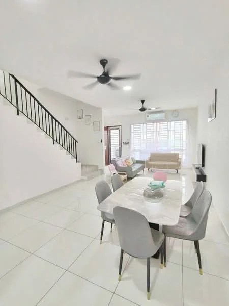 Living features: white painted walls, glossy white tile flooring, 5-blade ceiling fan with light, sofa in beige fabric, coffee table with marble top, TV console, wall-mounted TV, large windows with sheer curtains, decorative wall art, dining table with marble top and grey upholstered chairs; style: modern. Room features: staircase with black railing, light-colored walls, natural light from windows.