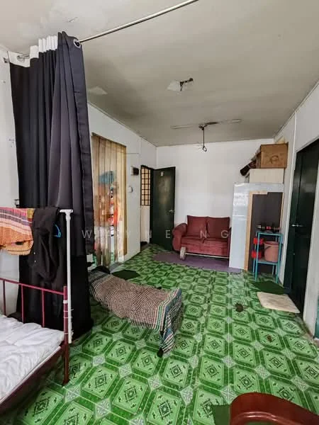 Room features: green patterned tile flooring, white painted walls, ceiling fan, curtains, sofa in maroon, bed frame with mattress, wooden cabinet, door to another room, partition curtain, window with sheer curtains; style: minimalist.