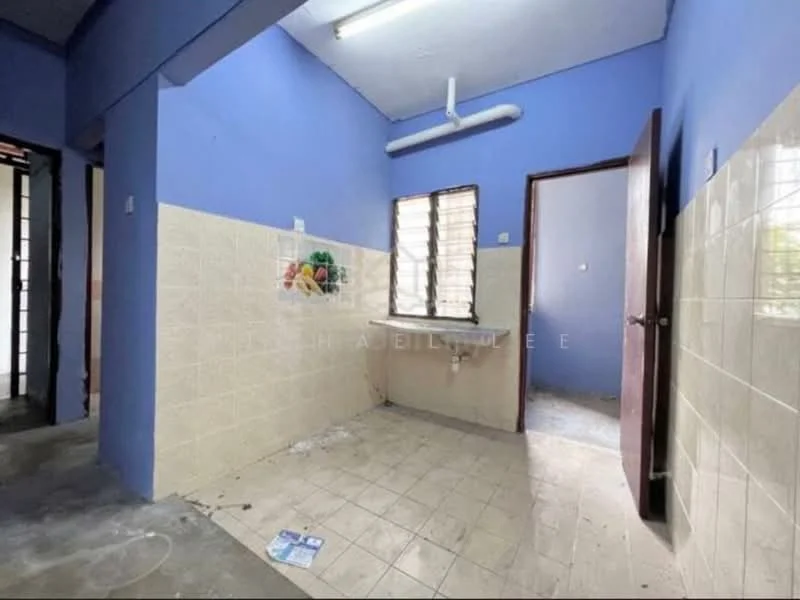 Room features: blue painted walls, cream tiled walls, grey tiled flooring, single-bowl sink, window with horizontal bars, wooden door, exposed pipe, light fixture on ceiling.