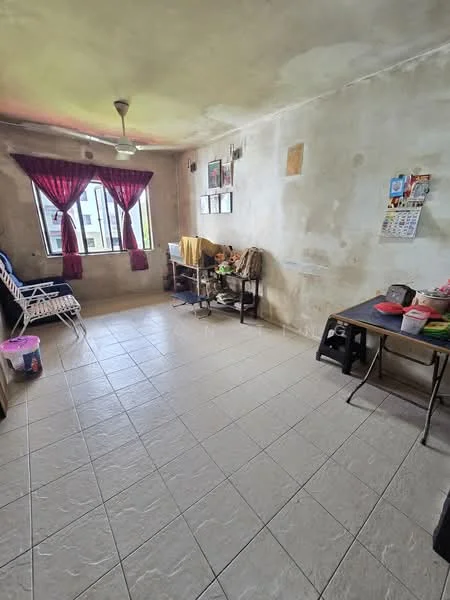 Room features: cream painted walls, tile flooring, ceiling fan, two windows with sheer curtains, wooden table, plastic chairs, wall-mounted photos, decorative calendar, foldable lounge chairs, various items on table.