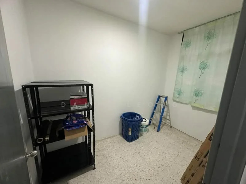 Room features: white painted walls, speckled tile flooring, single window with sheer curtains, metal shelving unit, blue laundry basket, step ladder, storage boxes.