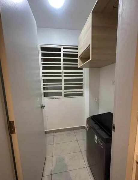 Laundry features: grey tiled flooring, white painted walls, window with metal grille, built-in wooden shelf, black washing machine, light fixture on ceiling.