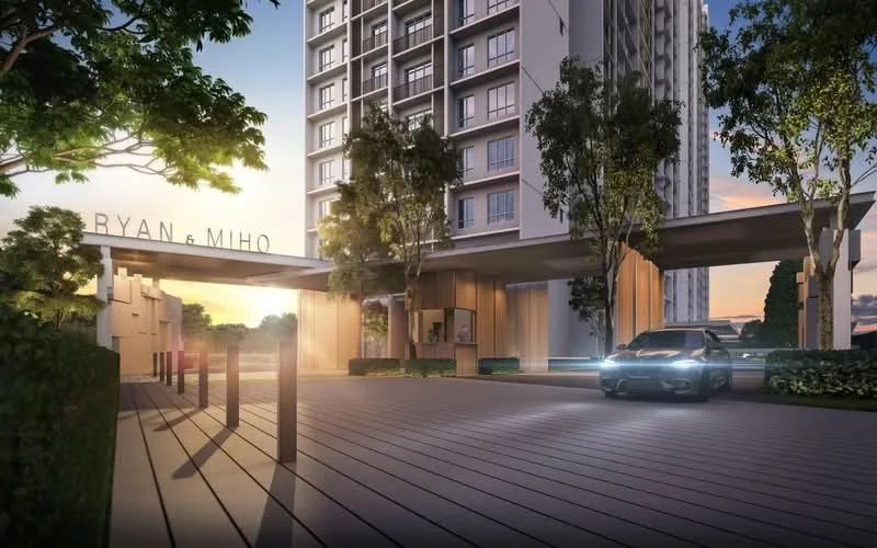 Exterior type: high-rise condominium; features: modern facade with glass and concrete, double-volume main lobby, landscaped entrance with trees, wooden deck at entrance, car porch with awning, surrounded by greenery, illuminated signage, driveway with interlocking pavers; style: modern.