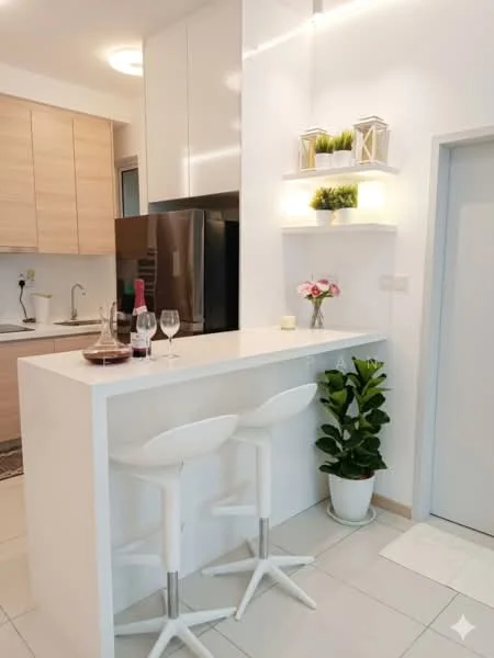Kitchen features: white cabinetry, light wood cabinetry, stainless-steel fridge, white countertop, bar seating with two white stools, decorative wall shelves, potted plant, wine glasses, bottle of wine, kitchen sink, modern faucet, tile flooring, recessed lighting; style: modern.