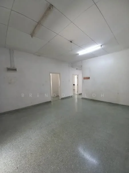 Room features: white painted walls, polished concrete flooring, drop ceiling with fluorescent lights, multiple doorways, no visible windows, neutral color scheme, spacious layout, high ceiling; style: minimalist.