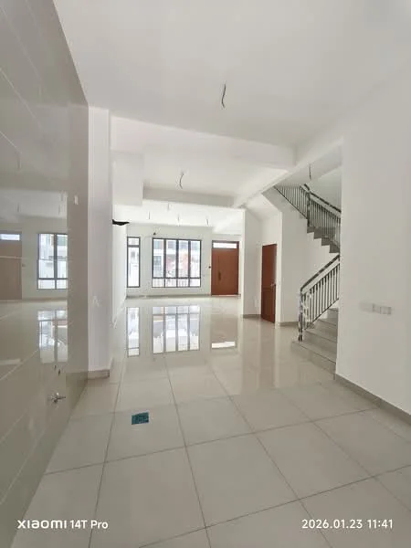 Room features: white painted walls, polished ceramic tile flooring, exposed ceiling with light fixtures, staircase with metal railing, large windows providing natural light, main entrance door, open layout, neutral color scheme; style: modern.