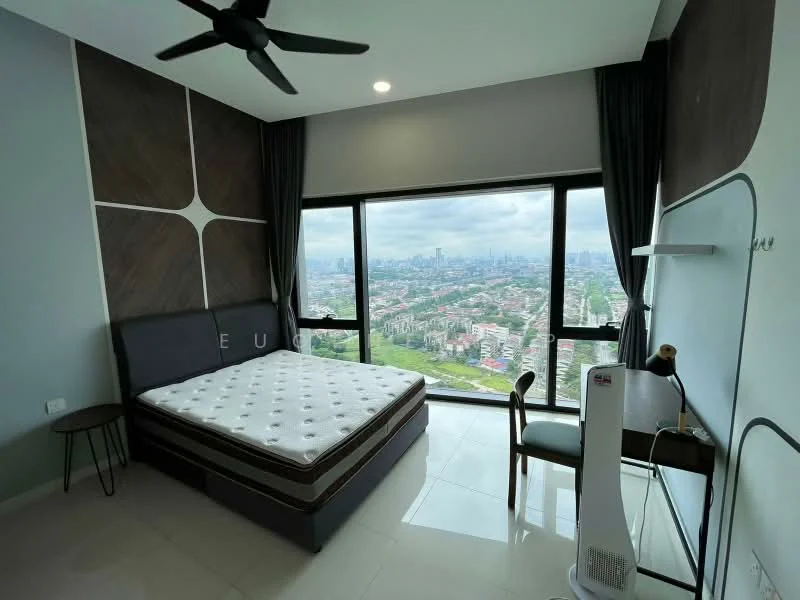 Bedroom features: king-size bed, upholstered headboard, floor-to-ceiling windows, city view, grey painted walls, wood accent wall, white ceiling, 5-blade ceiling fan, white tile flooring, nightstand, freestanding fan, study desk, wall-mounted shelf; style: modern; view: city.