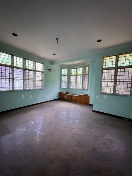 Room features: light green painted walls, wooden flooring, multiple windows with grid pattern, 1 wall-mounted split AC, ceiling lights, built-in wooden cabinet, no visible furniture, empty space.