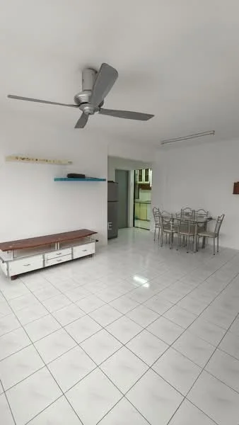 Living features: white painted walls, glossy white tile flooring, 5-blade ceiling fan with light, wooden TV console, metal dining table with chairs, open layout, refrigerator visible in background, shelving unit on wall; style: modern.