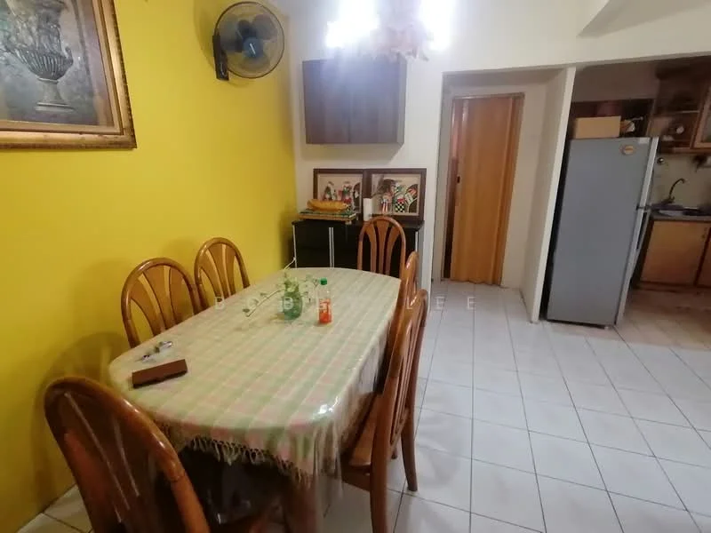 Dining features: yellow painted walls, white tiled flooring, wooden dining table, 6 wooden dining chairs, ceiling fan, framed artwork on wall, glass bottle on table, plastic bottle on table, wooden cabinet, doorway leading to another room, refrigerator in adjacent kitchen area; style: traditional.