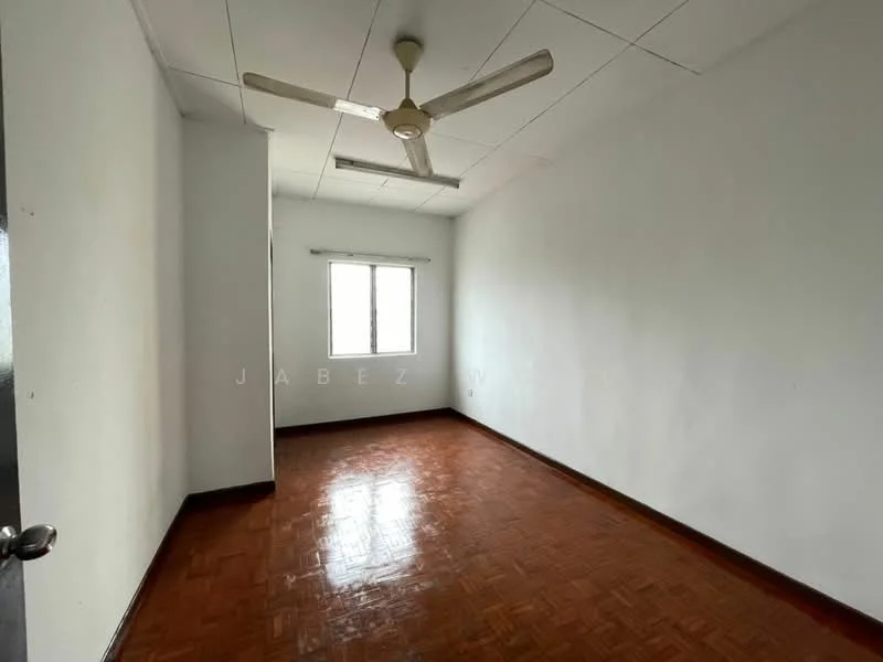 Room features: white painted walls, parquet wood flooring, ceiling fan, single window, natural light, plain ceiling, no visible furniture, empty space; style: minimalist.