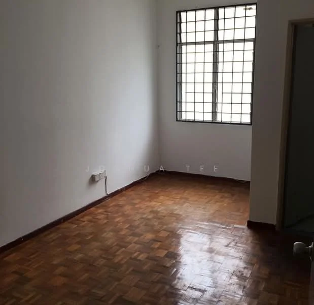 Room features: wooden flooring, white painted walls, square grid window, single light switch, corner entry door.